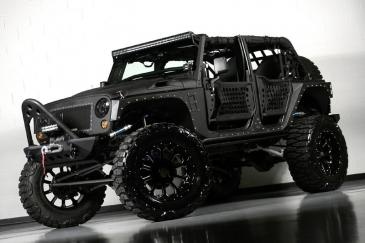 Custom 2013 Jeep Wrangler Unlimited Full Metal Jacket..The baddest Jeep on the market!  Click on the link to video photos and video of this Jeep in action..it gets air!!
