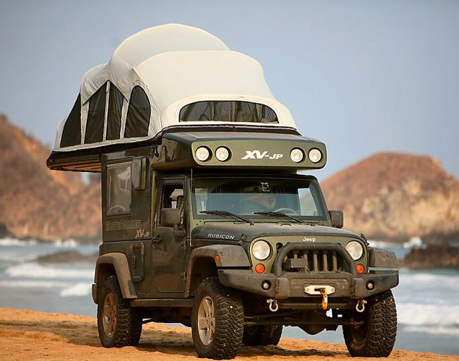 Earth Roamer Jeep Rubicon with 9 feet of standing space, queen bed, toilet, 100L water tank, shower, sink, cooking and solar powered fridge.