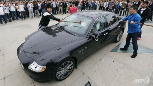 Chinese man smashes his $420,000 Maserati Quattroporte in protest of bad service